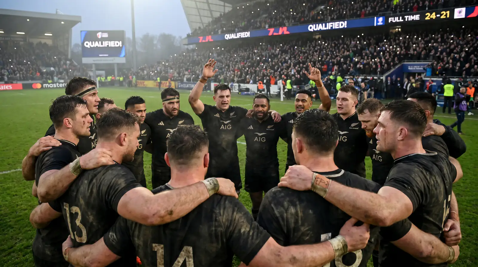 Rugby team celebrating qualification after finishing third in competitive World Cup pool