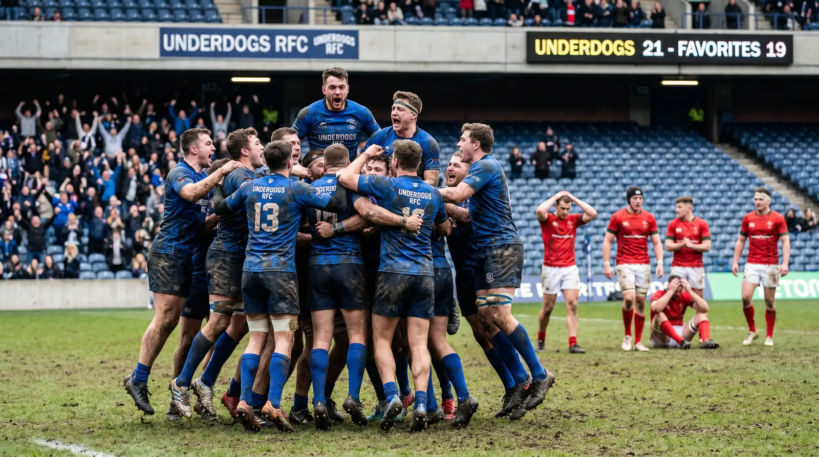 Rugby players celebrating shock victory on pitch representing famous World Cup upset moment