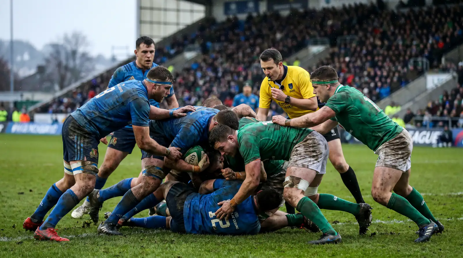 Rugby forwards battling at breakdown in tight defensive knockout match with low scoring