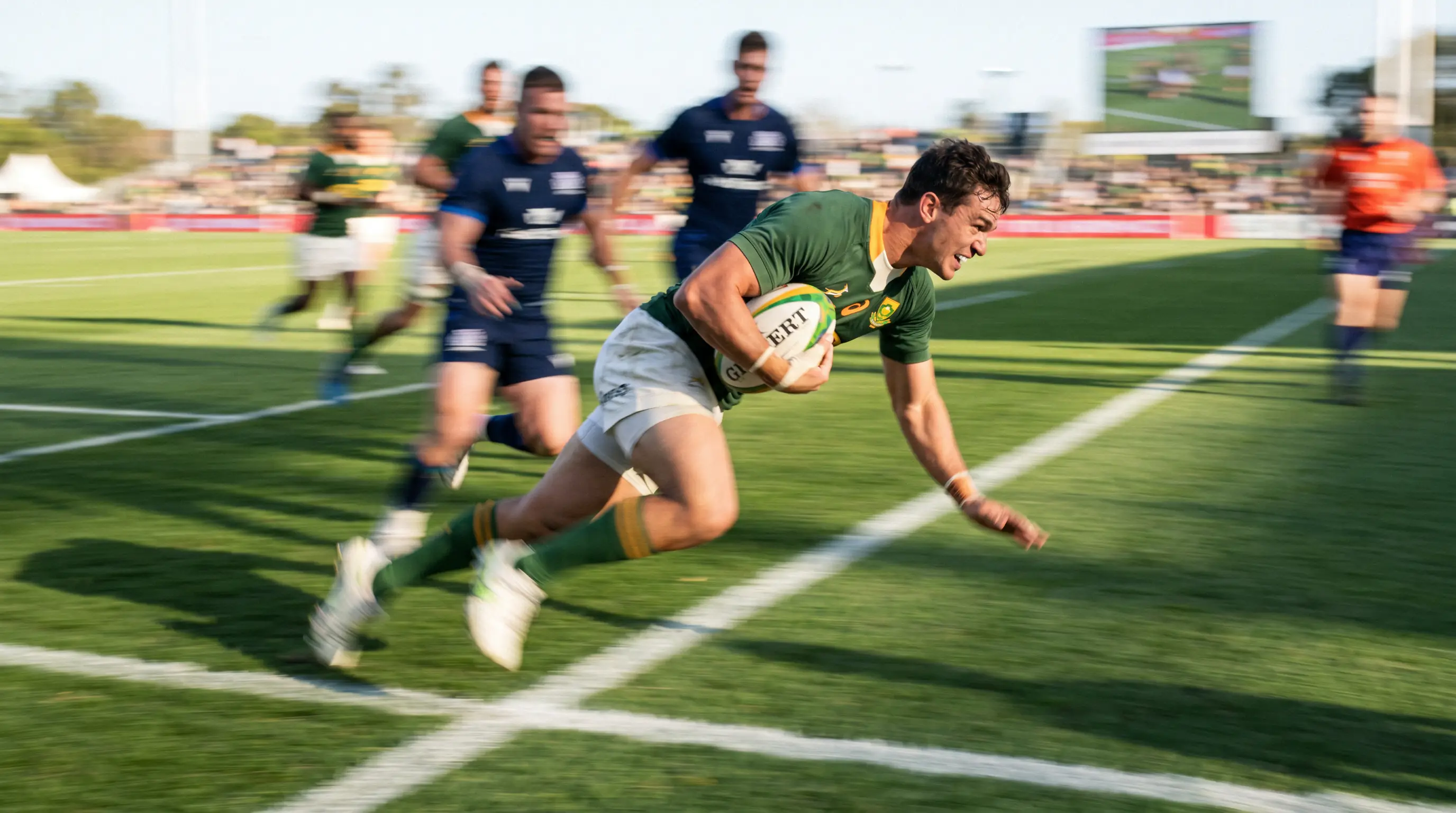 Rugby winger sprinting towards the try line during a World Cup match