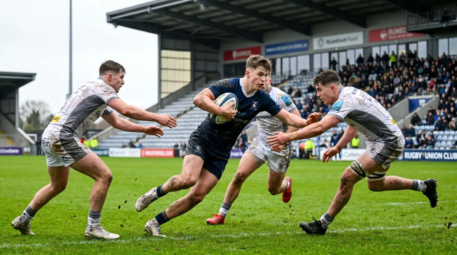 Young rugby players competing in Super Rugby Pacific match showcasing All Blacks pipeline
