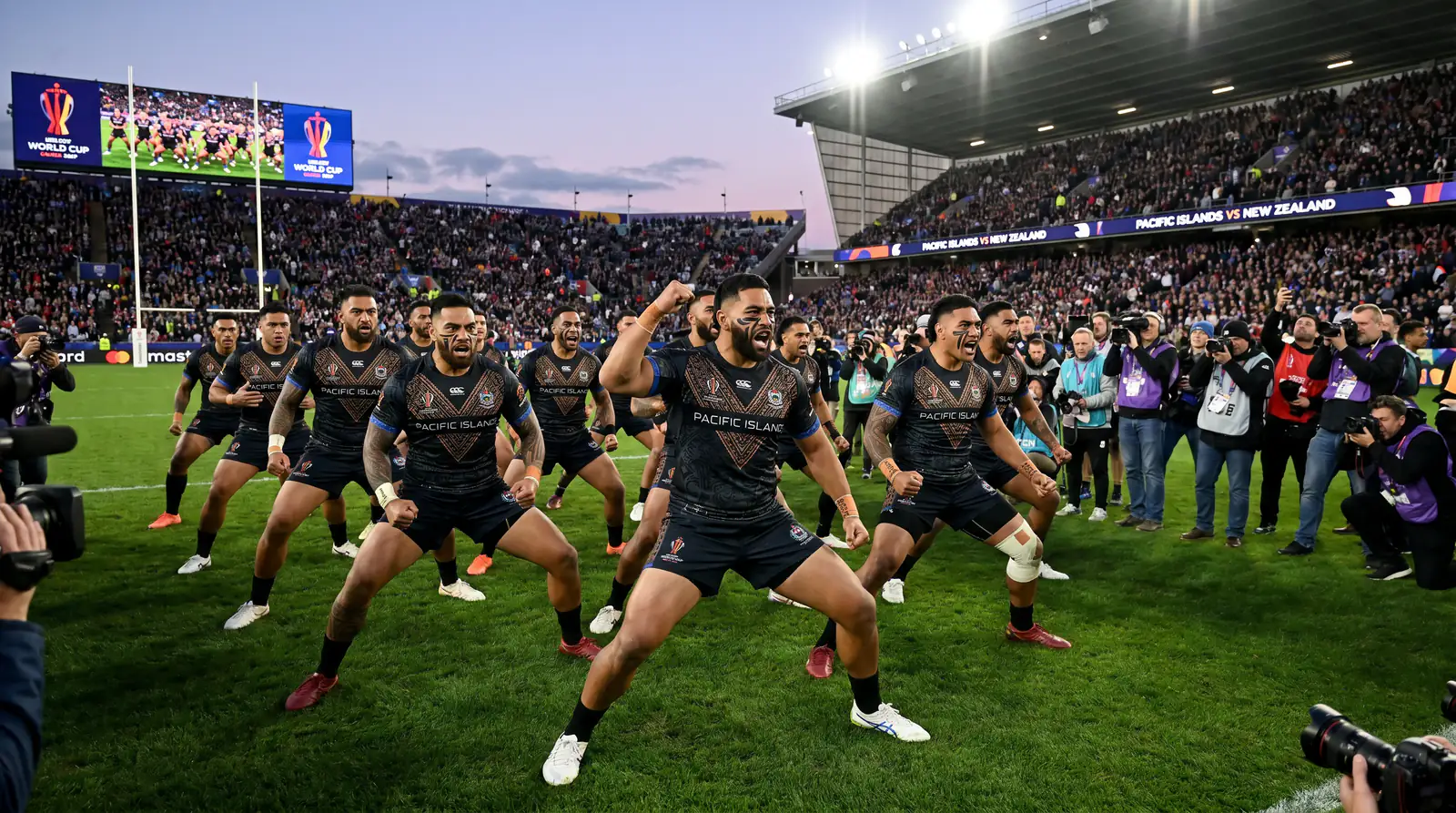 Pacific Island rugby players performing traditional war dance before Rugby World Cup match